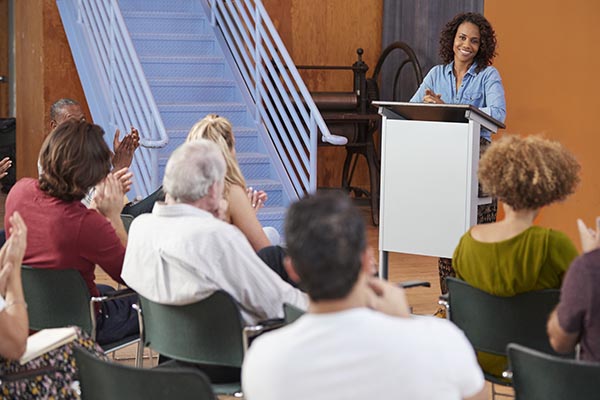 Woman Speaking to a Small Audience